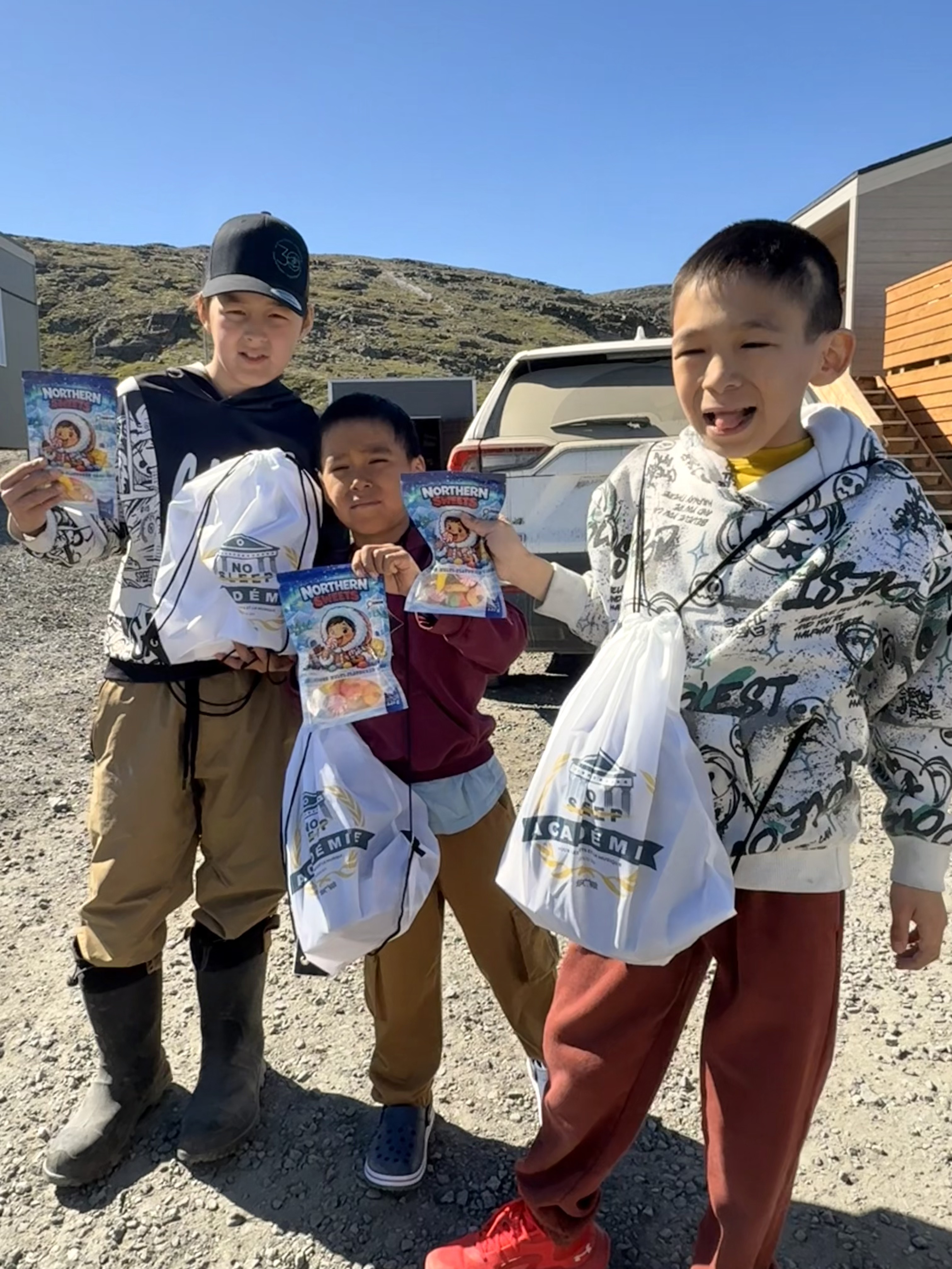 Kids showing off Northern Sweets bags