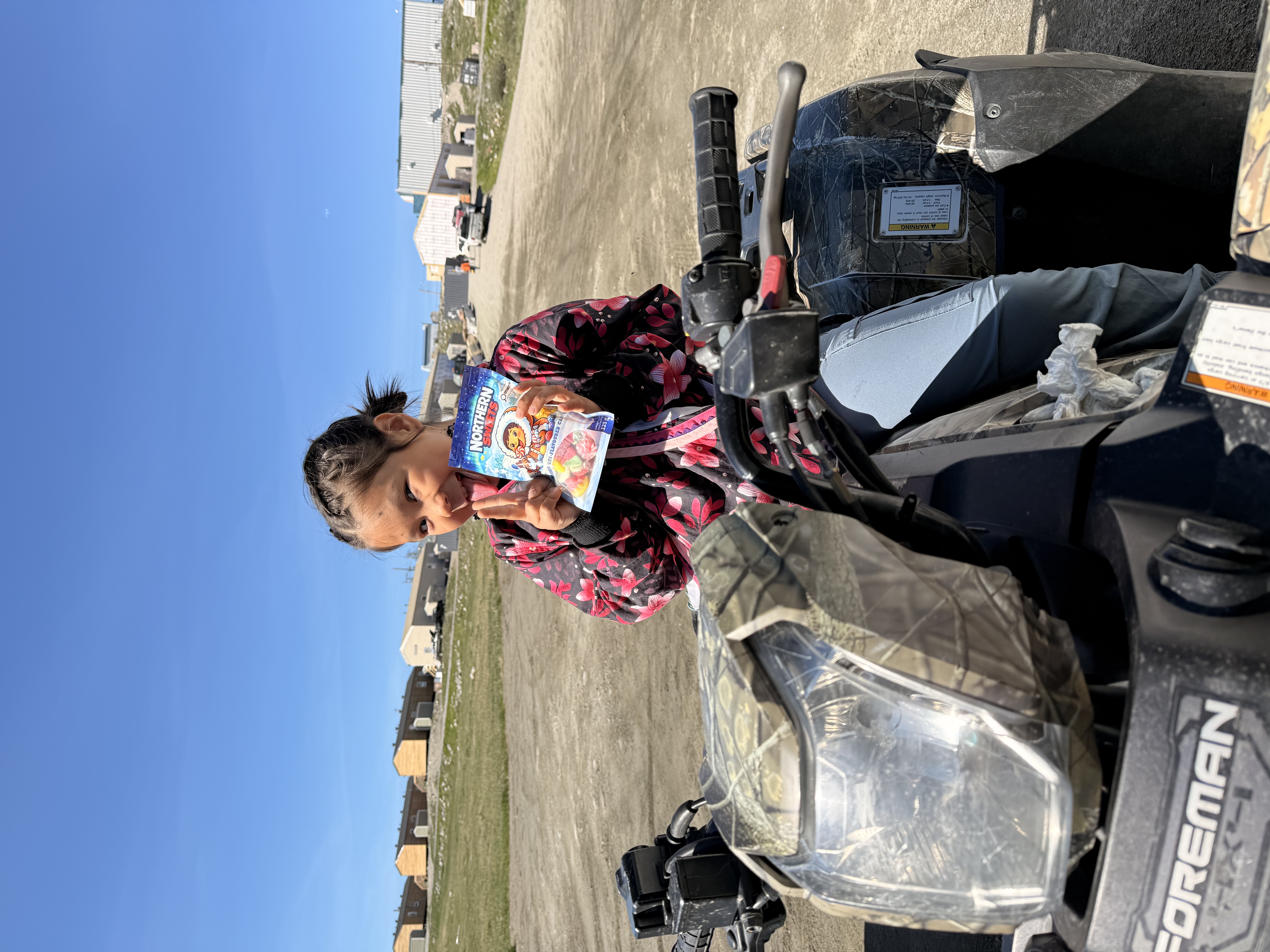 Girl on ATV with Northern Sweets bag